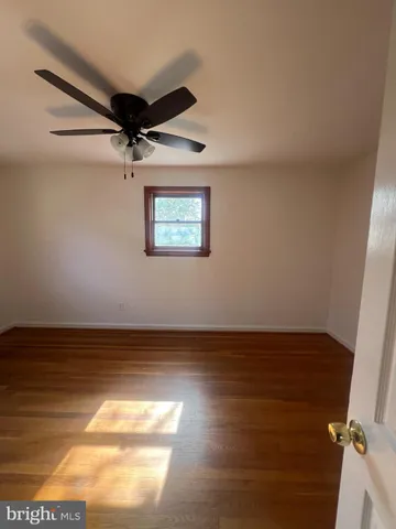 a view of room with wooden floor