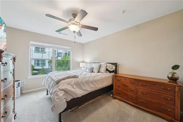 a bed room with a bed and a window