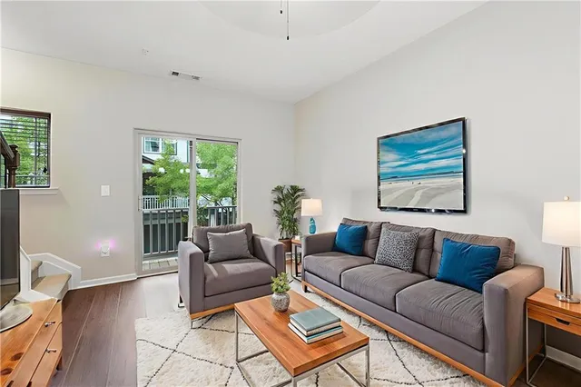 a living room with furniture and a window