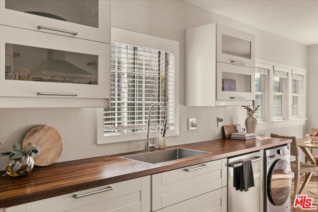 a kitchen with a sink and a microwave