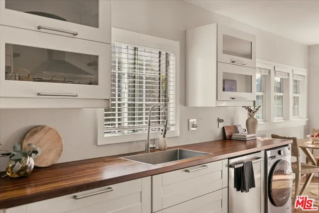 a kitchen with a sink and a microwave