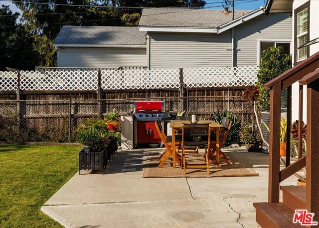 a view of a chairs and table in the patio