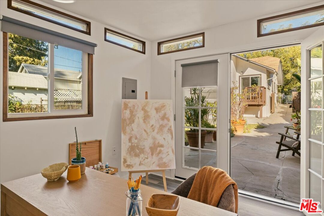 3764 Valleybrink Road Los Angeles, CA 90039 - Photo 30 of 35 a living room with furniture and a large window