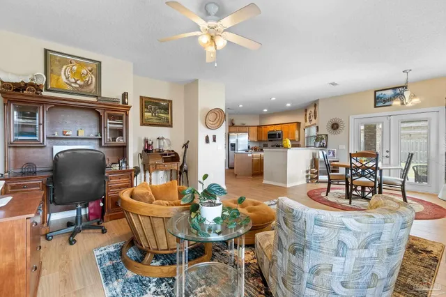 a living room with fireplace furniture and a flat screen tv