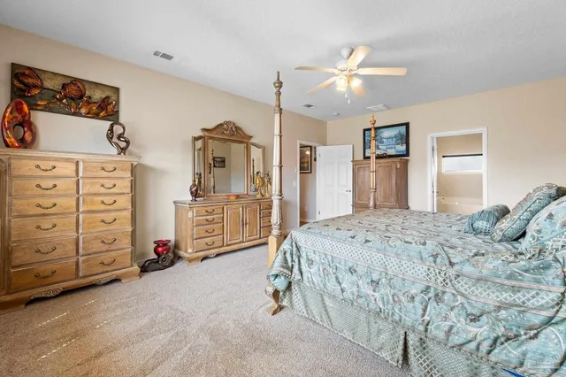 a bedroom with a bed and a cabinets