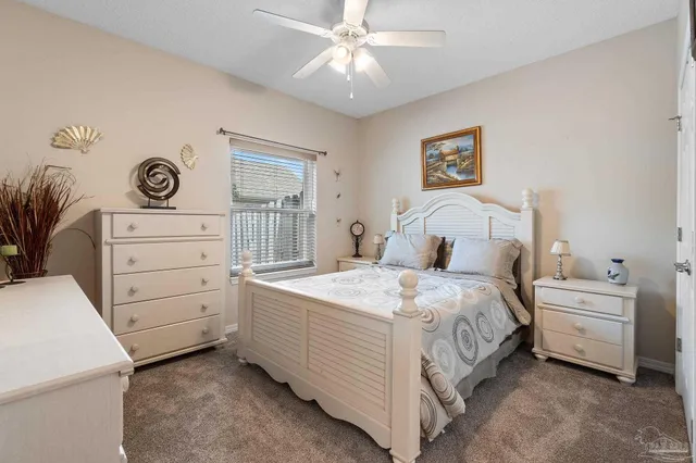 a bedroom with a bed and a cabinets