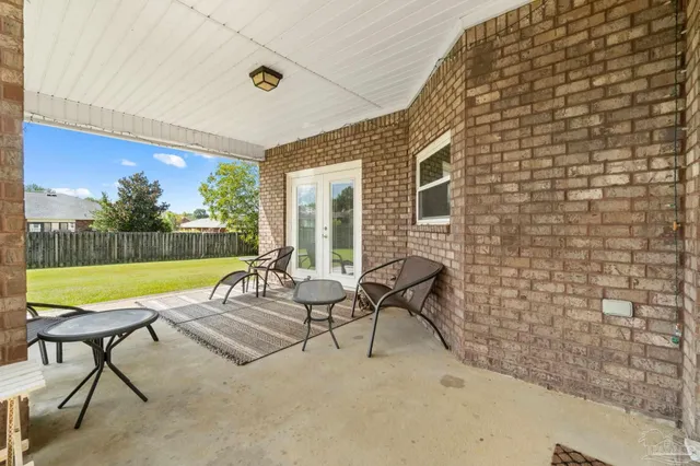 a view of a swimming pool with a patio