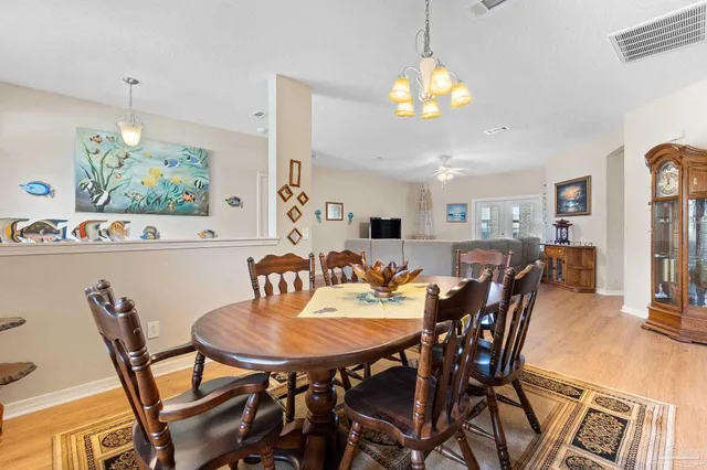 a view of a dining room and a chandelier