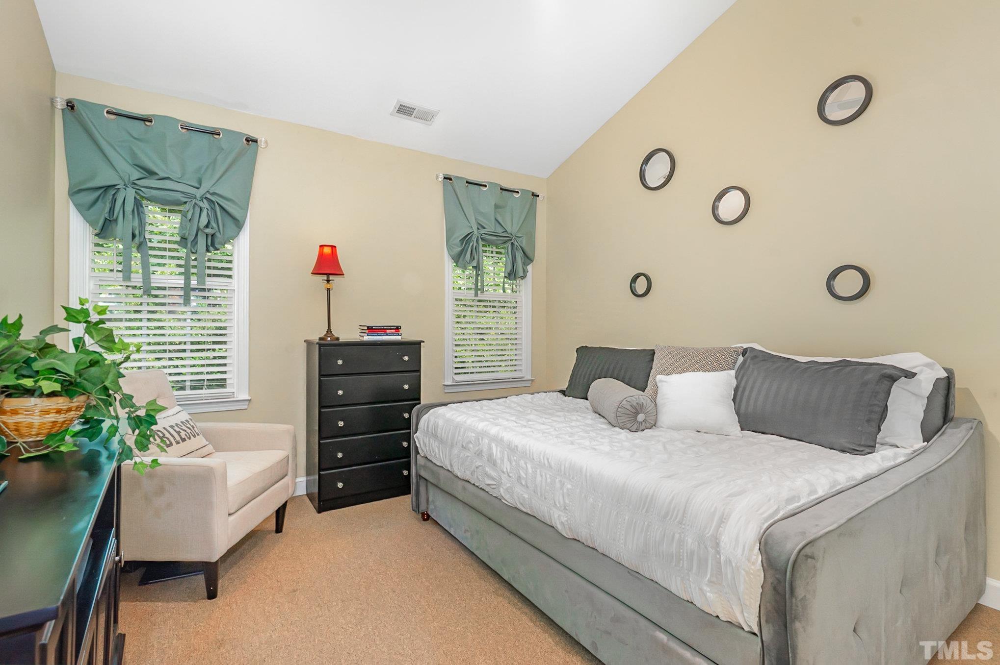 6026 Kohler Lane Raleigh, NC 27616 - Photo 13 of 15 a bedroom with a bed and a couch