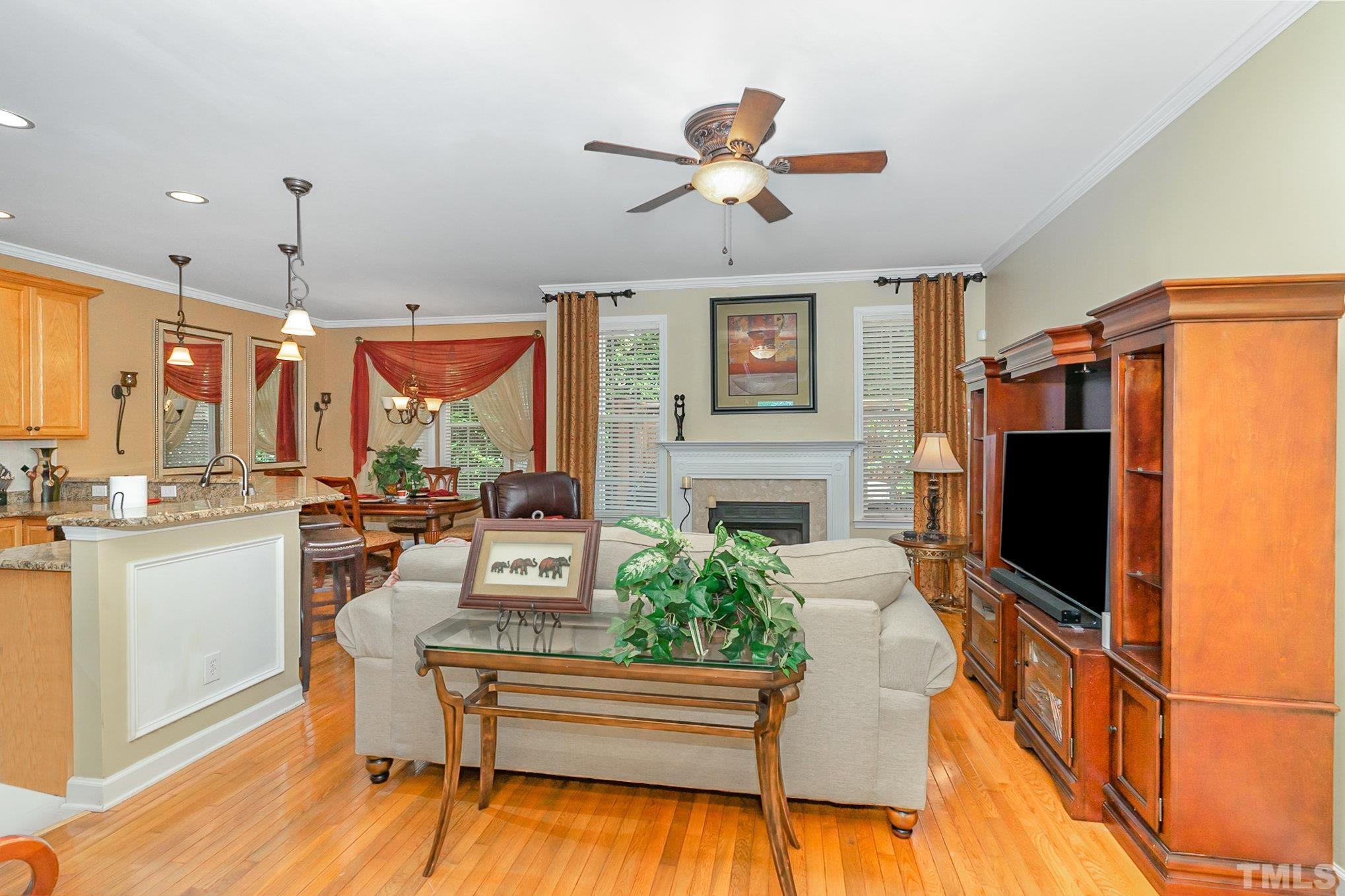 6026 Kohler Lane Raleigh, NC 27616 - Photo 6 of 15 a living room with furniture a flat screen tv and kitchen view