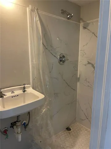 a bathroom with a sink and mirror
