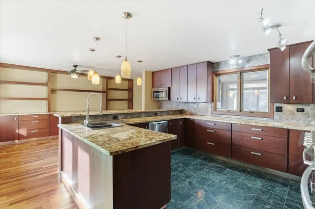 a living room with hard wood floors and a window