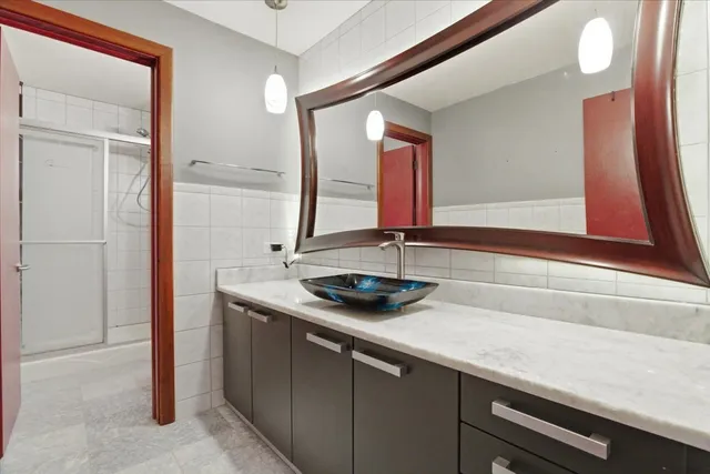 a bathroom with a sink and mirror