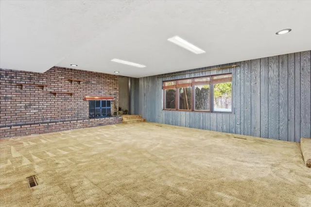 a room with wooden floor and furniture