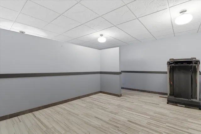 a room with wooden floor and table