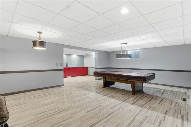 a kitchen with wooden cabinets and a sink