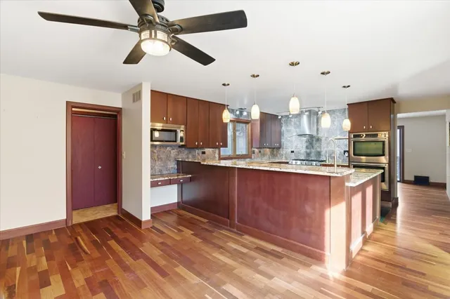 a kitchen with a stove and a microwave