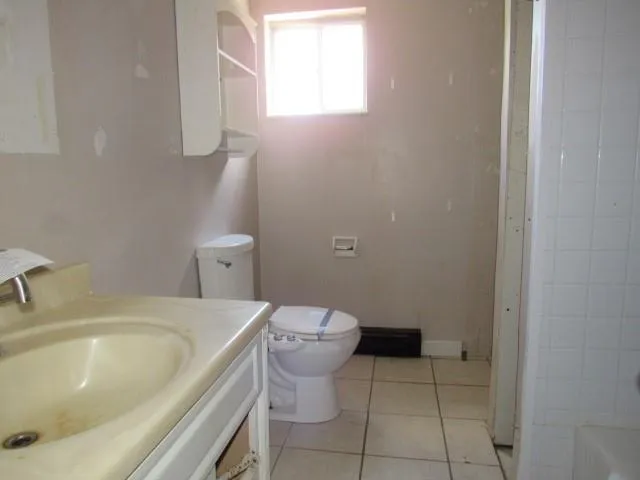 a bathroom with a sink and toilet