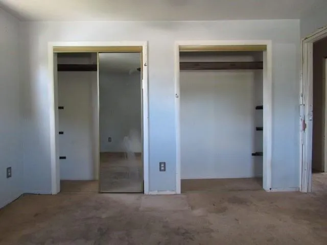 a view of a room with racks on the wall