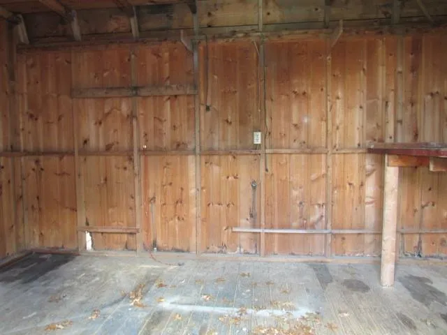 a view of a room with wooden walls