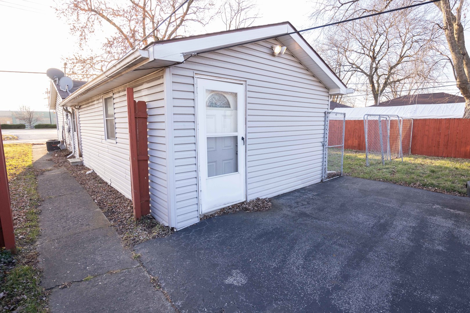 2024 Plainfield Road Crest Hill, IL 60403 - Photo 11 of 20 a view of a house with a yard and wooden fence