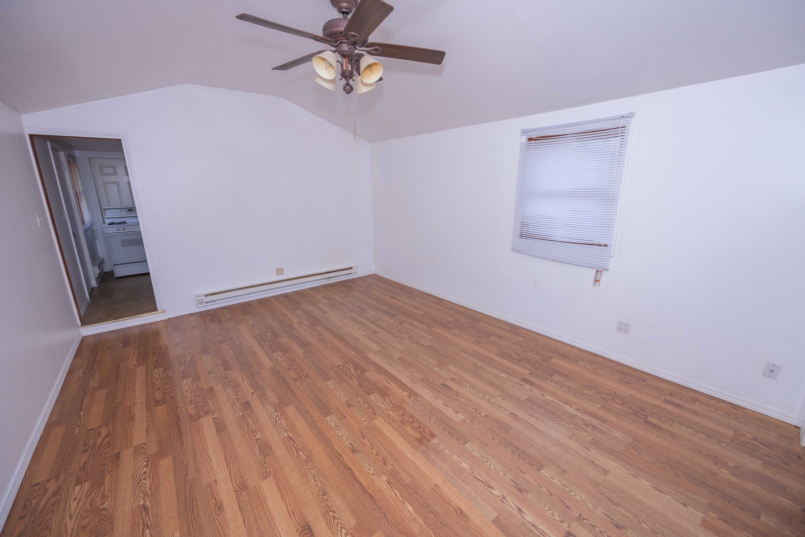 2024 Plainfield Road Crest Hill, IL 60403 - Photo 13 of 20 a view of empty room with wooden floor and fan
