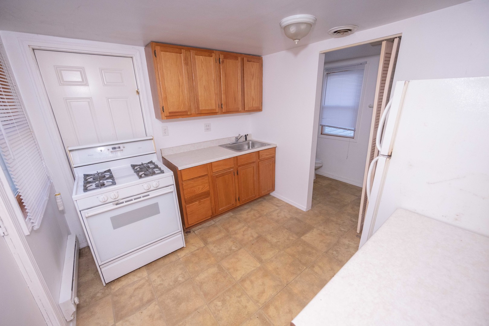 2024 Plainfield Road Crest Hill, IL 60403 - Photo 14 of 20 a kitchen with stainless steel appliances granite countertop a refrigerator and a stove