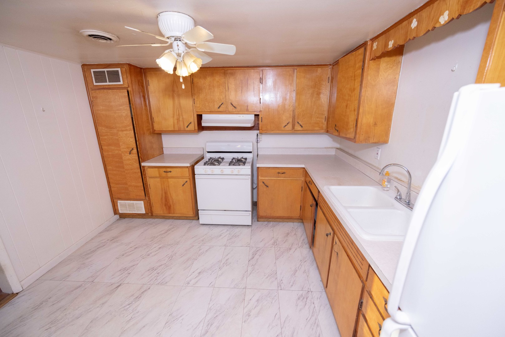 2024 Plainfield Road Crest Hill, IL 60403 - Photo 5 of 20 a kitchen with stainless steel appliances granite countertop a sink a stove top oven a chimney and a microwave
