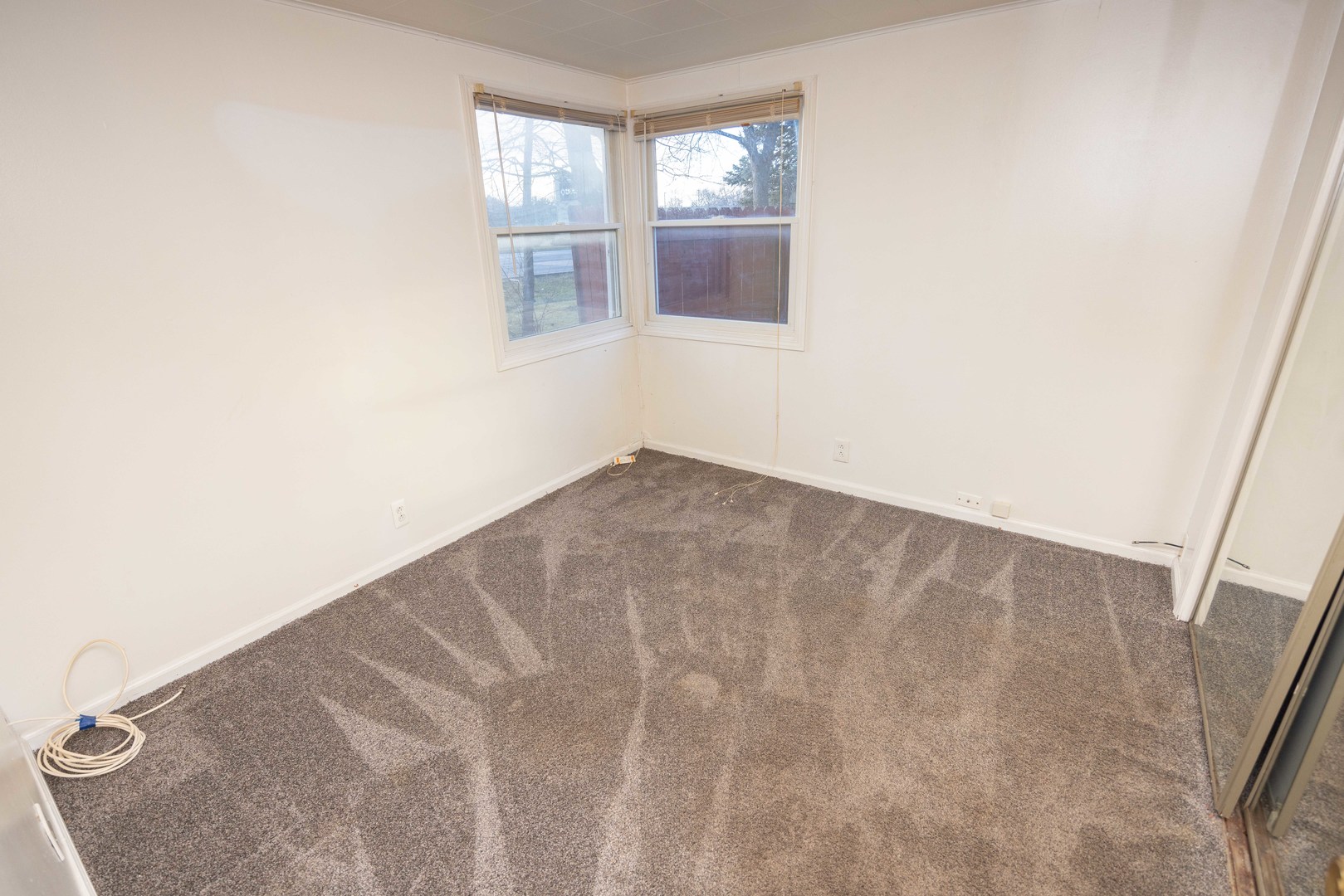 2024 Plainfield Road Crest Hill, IL 60403 - Photo 7 of 20 an empty room with windows