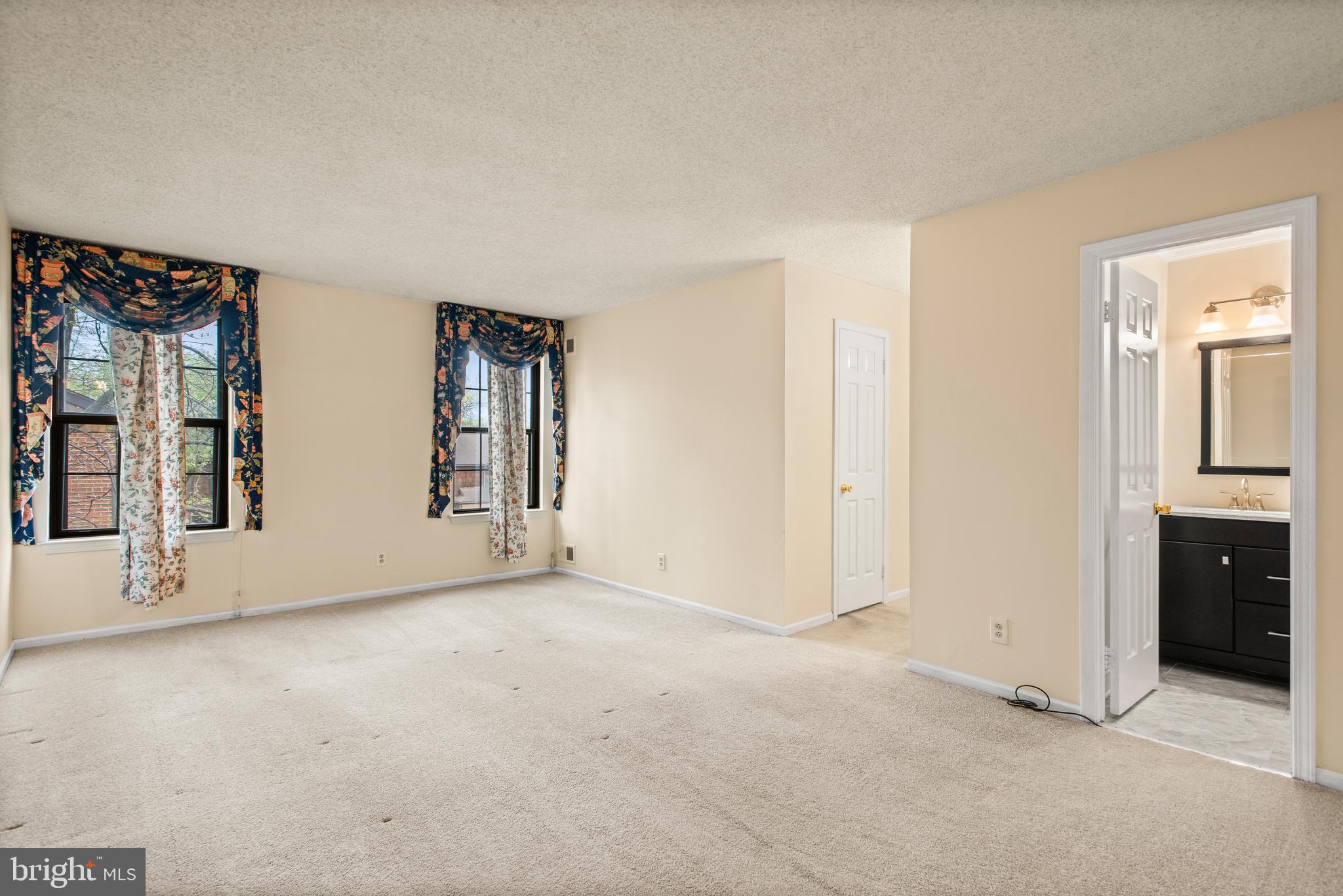 1108 Bartlett Road, Unit 170 Chesterbrook, PA 19087 - Photo 13 of 22 an empty room with windows and closet