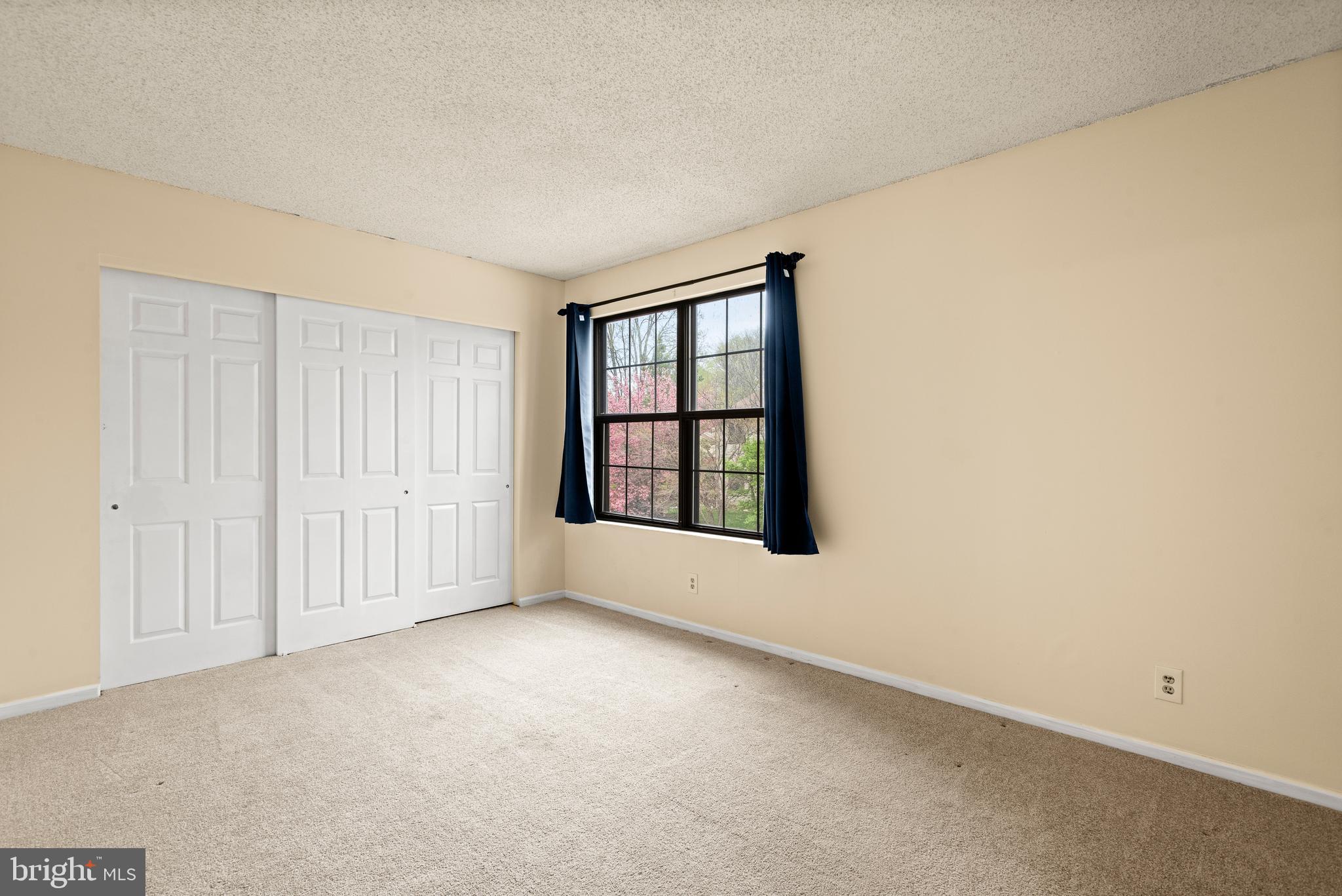 1108 Bartlett Road, Unit 170 Chesterbrook, PA 19087 - Photo 17 of 22 an empty room with windows