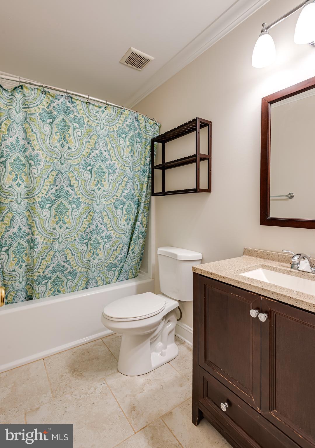 1108 Bartlett Road, Unit 170 Chesterbrook, PA 19087 - Photo 19 of 22 a bathroom with a toilet sink and mirror