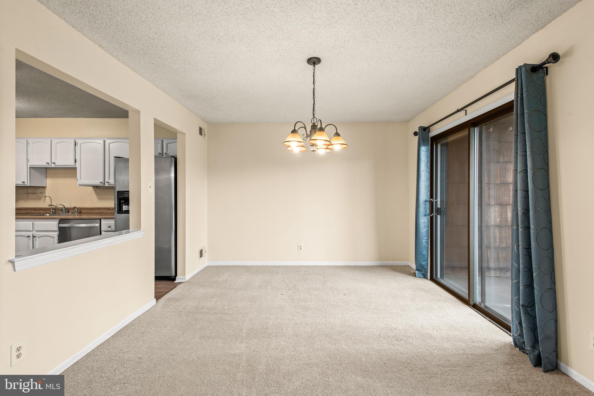 1108 Bartlett Road, Unit 170 Chesterbrook, PA 19087 - Photo 5 of 22 a view of a kitchen with granite countertop cabinets and a wooden floor