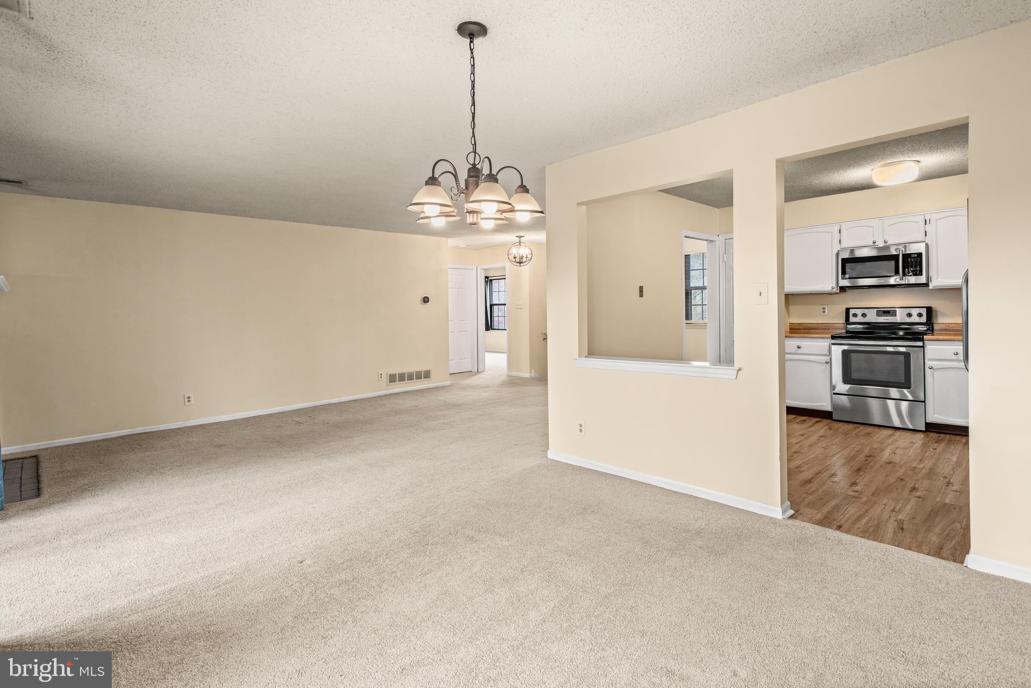1108 Bartlett Road, Unit 170 Chesterbrook, PA 19087 - Photo 6 of 22 a view of a kitchen with a sink and refrigerator