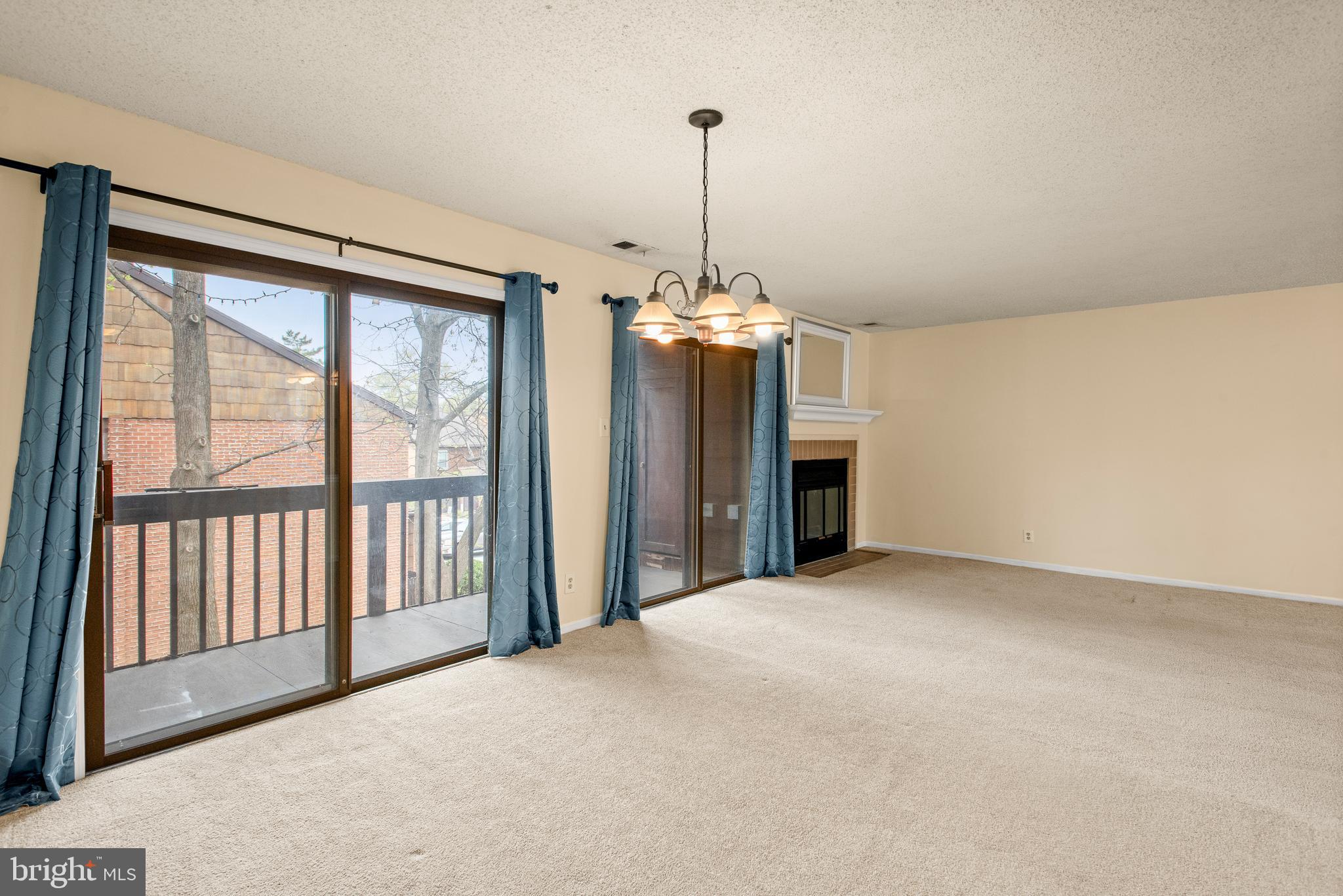 1108 Bartlett Road, Unit 170 Chesterbrook, PA 19087 - Photo 7 of 22 a view of a livingroom with a chandelier fireplace and a chandelier