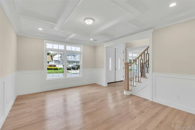 a kitchen with kitchen island granite countertop a stove and a sink