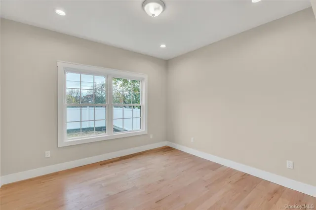 a kitchen with white cabinets and appliances