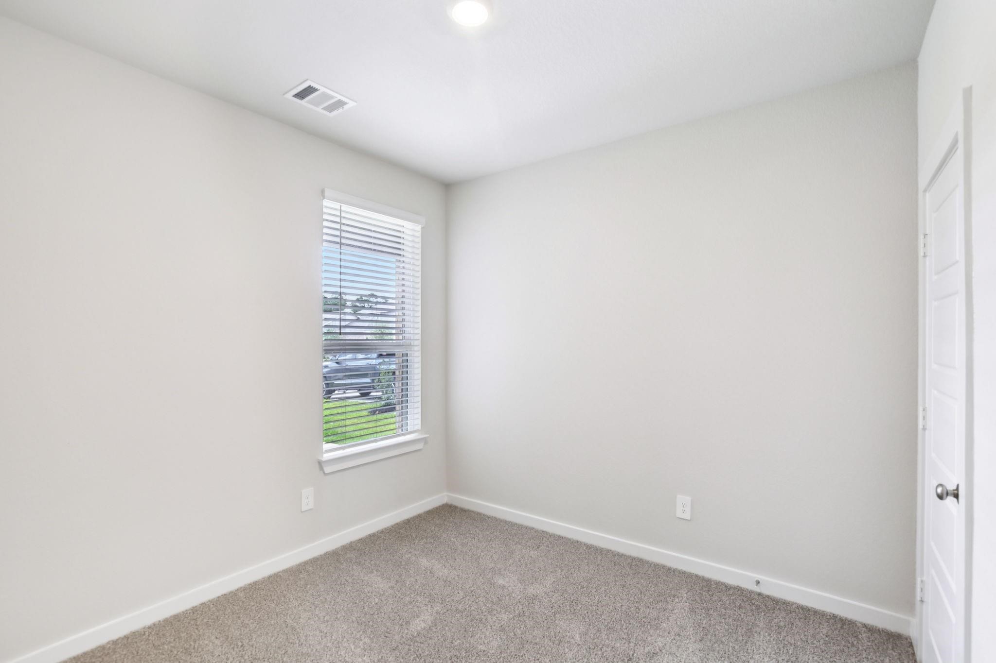 6717 Chinapkin Lane Conroe, TX 77304 - Photo 12 of 15 an empty room with windows