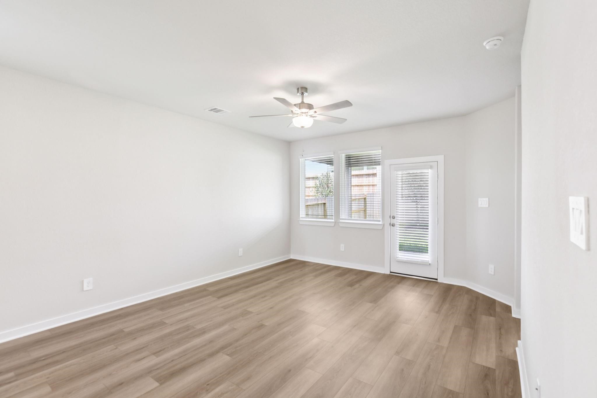 6717 Chinapkin Lane Conroe, TX 77304 - Photo 13 of 15 wooden floor in an empty room with a window