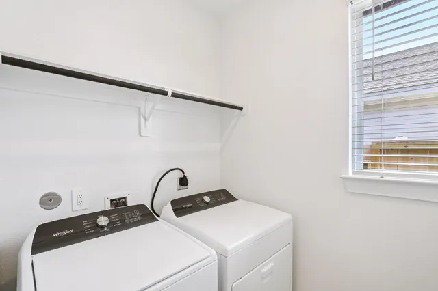 a close view of sink a washer and dryer