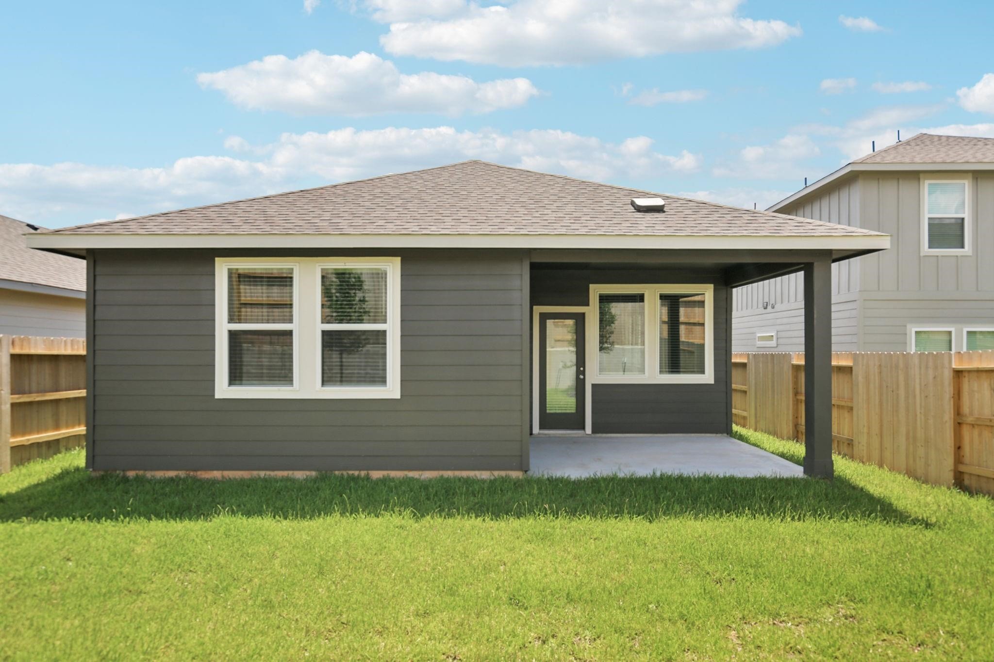 6717 Chinapkin Lane Conroe, TX 77304 - Photo 15 of 15 a front view of a house with a garden