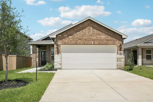 a front view of house with garage and yard