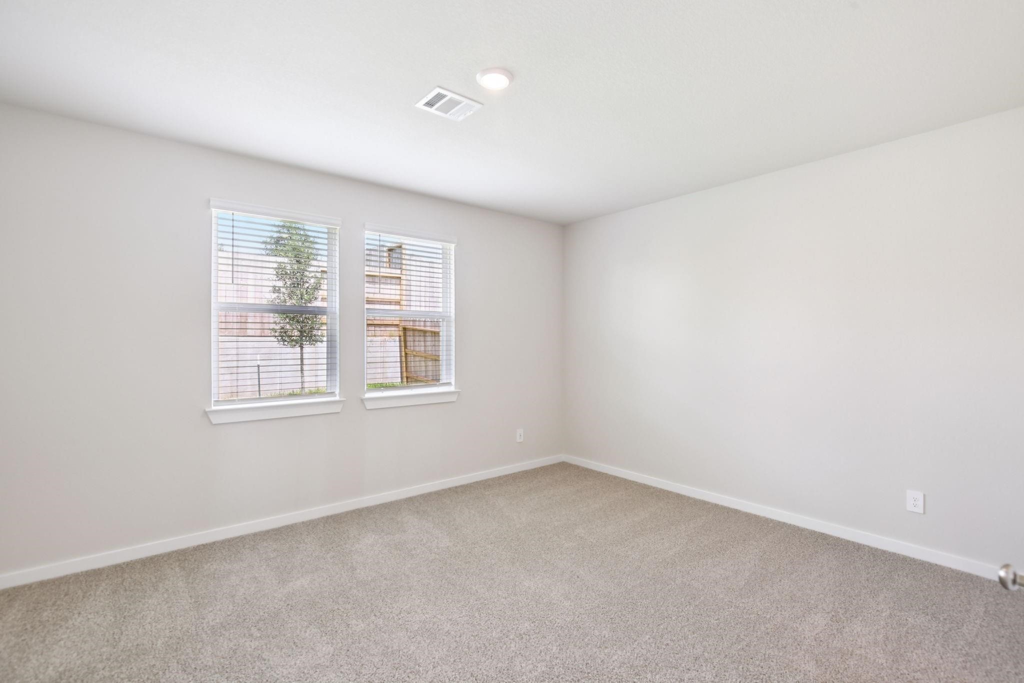 6717 Chinapkin Lane Conroe, TX 77304 - Photo 6 of 15 an empty room with windows