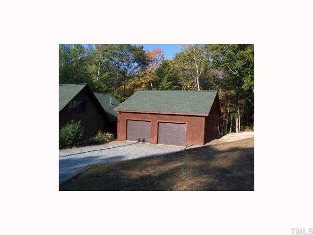 2147 Jimmie Kerr Road Graham, NC 27253 - Photo 3 of 9 New Garage with workshop and walk up stairs to upper level storage