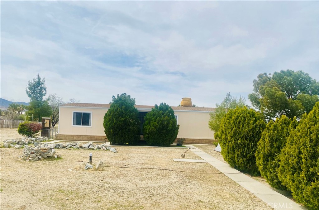 11174 Wintergreen Road Pinon Hills, CA 92372 - Photo 1 of 1 a view of a house with a yard
