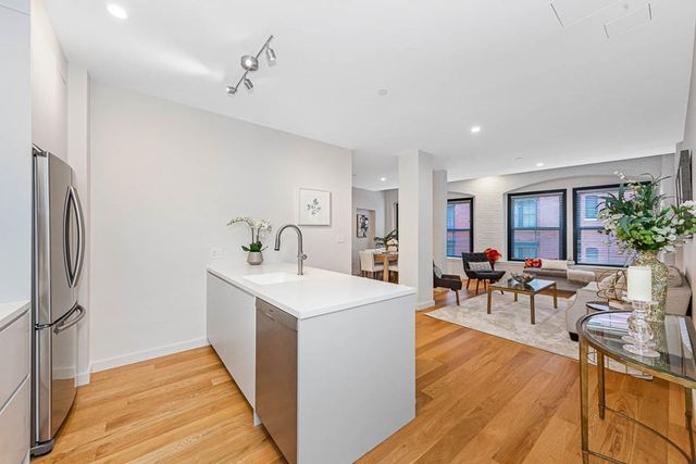 a view of a living room and dining room