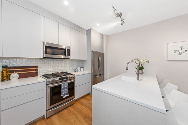 a kitchen with a stove and a microwave