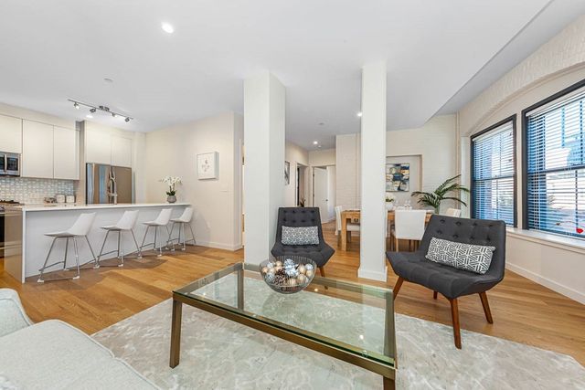 a living room with furniture and a table