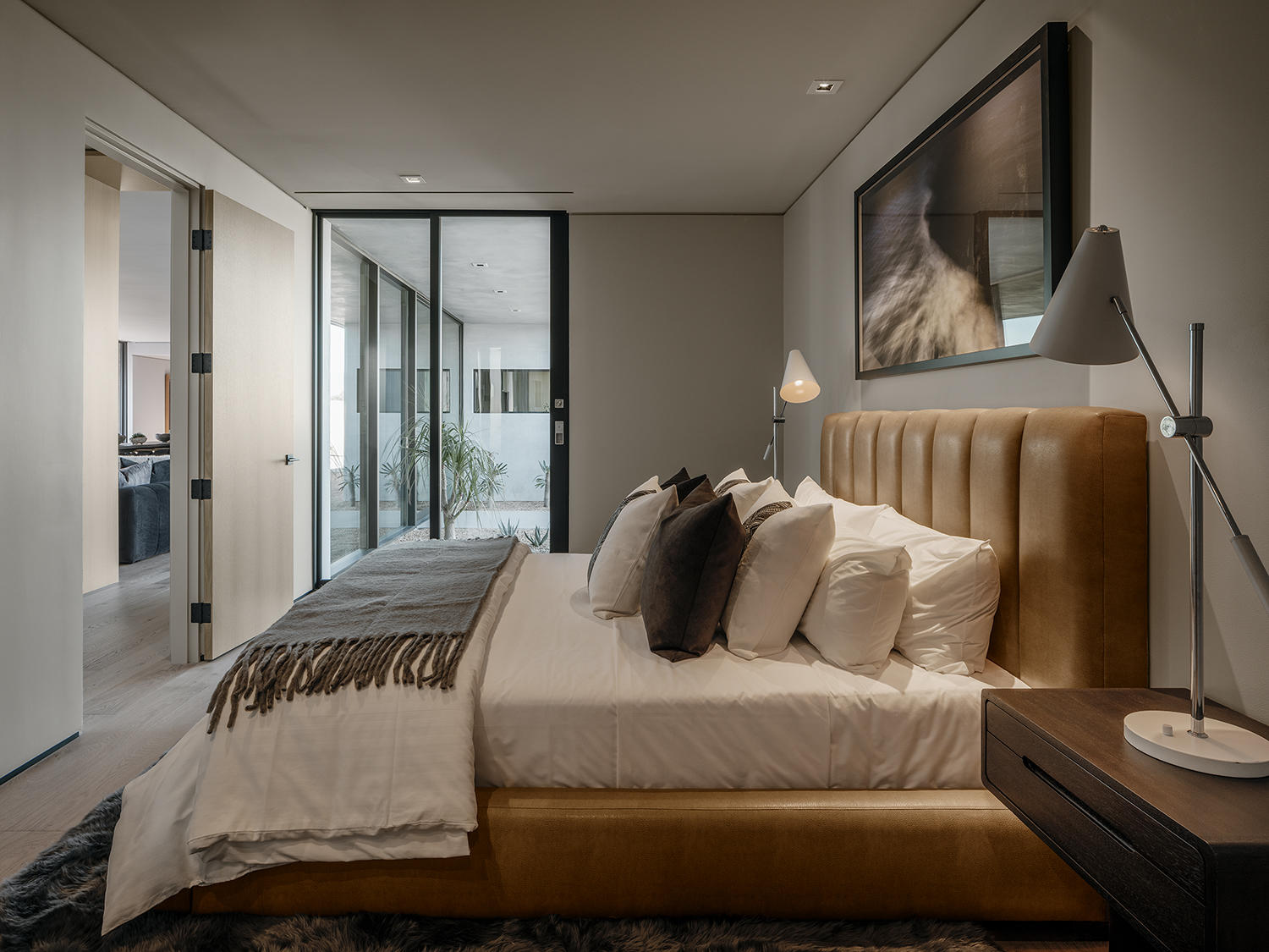 4 Echo Lane Rancho Mirage, CA 92270 - Photo 21 of 40 a bedroom with a bed and glass window