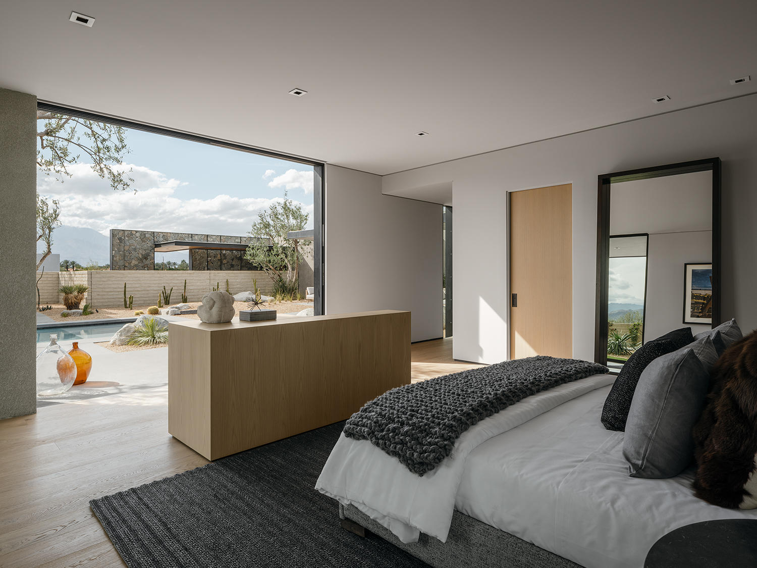 4 Echo Lane Rancho Mirage, CA 92270 - Photo 23 of 40 a bedroom with a bed and large windows